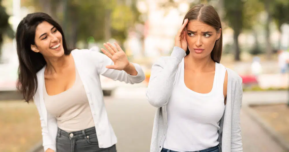Woman realizing she's in a toxic relationships and trying to ignore toxic friend