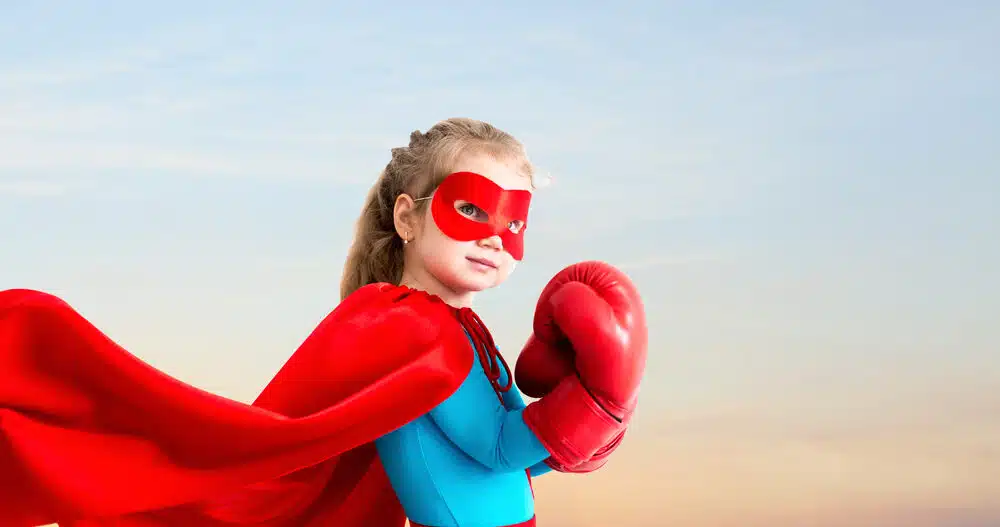 Little girl wearing a superhero costume