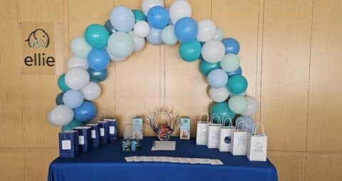 Ellie Mental Health Peachtree City, GA Clinic Welcome Booth with balloons and gift bags