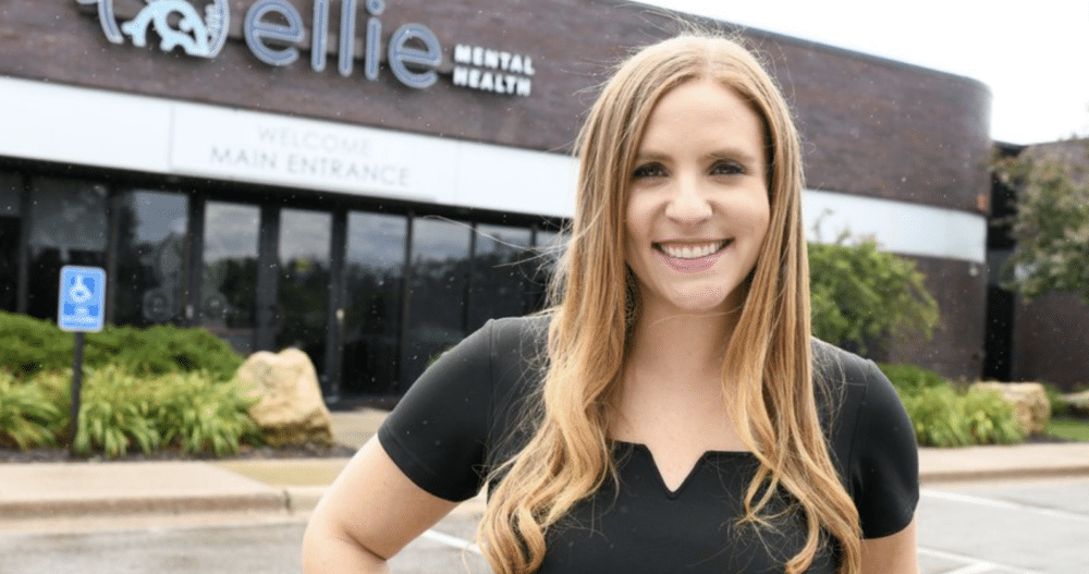 Ellie Mental Health Founder and CEO Erin Pash standing outside the Mendota Heights, MN Clinic