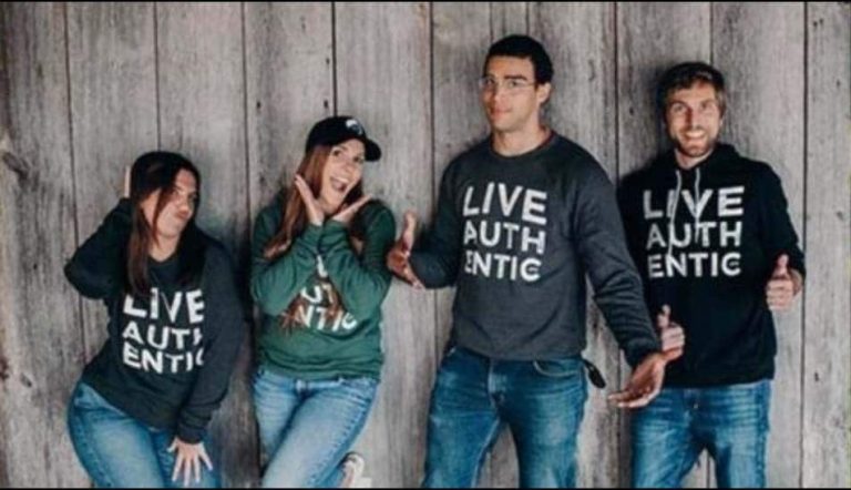 Four Ellie Mental Health professionals posing for the camera wearing branded Ellie Mental Health LIVE AUTHENTIC sweatshirts.