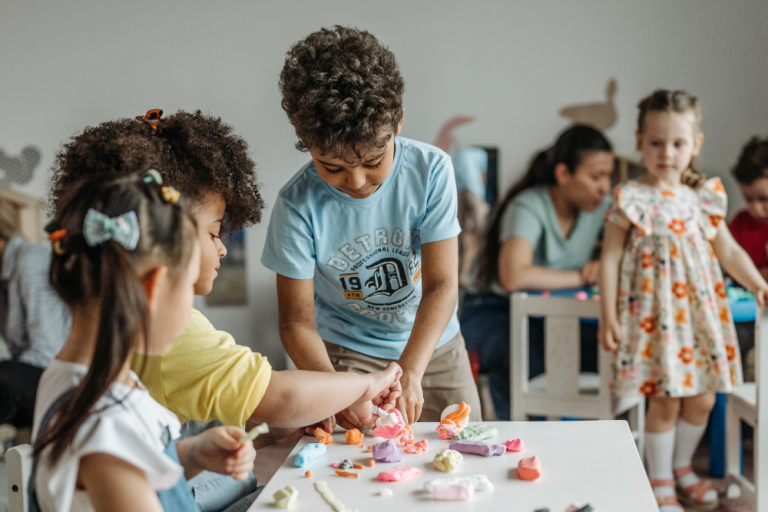 A group of kids doing arts and crafts together in school