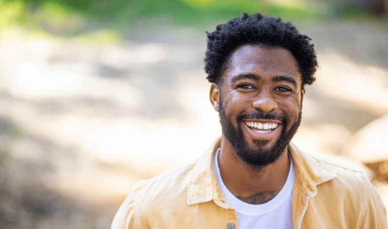 Man standing outside smiling