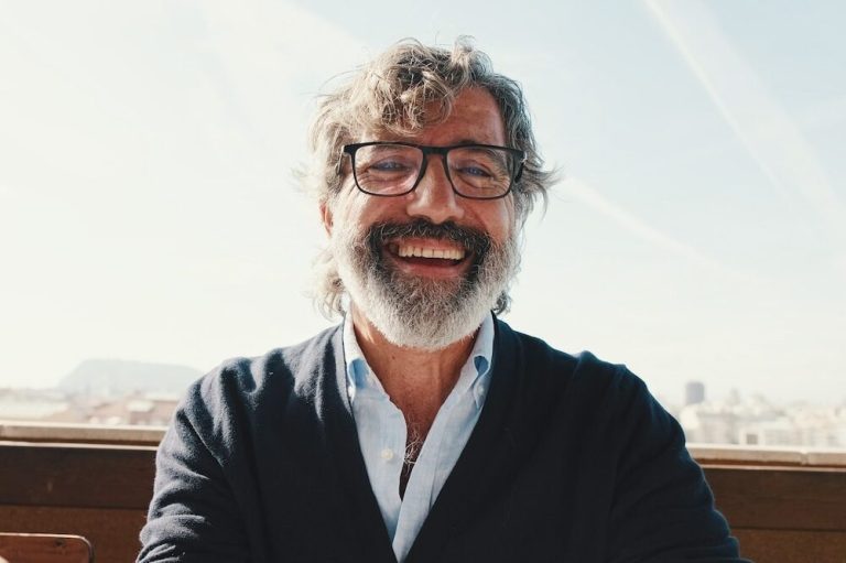 Close-up,Of,Mature,Man,Taking,Selfie,While,Standing,On,Balcony,