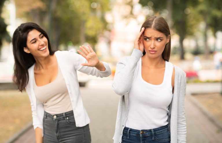 Woman realizing she's in a toxic relationships and trying to ignore toxic friend