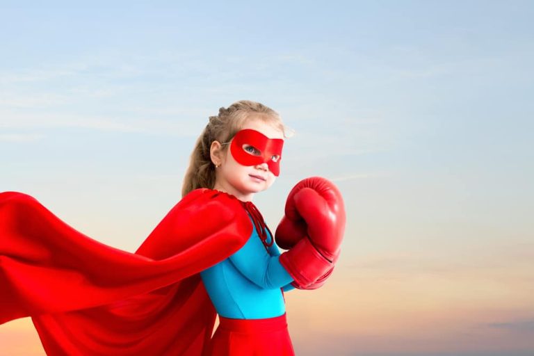 Little girl wearing a superhero costume