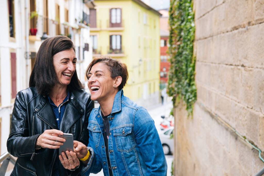 Couple laughing together outside in the city