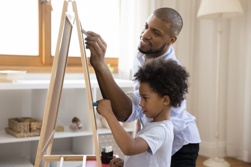Art Therapist painting with a young client